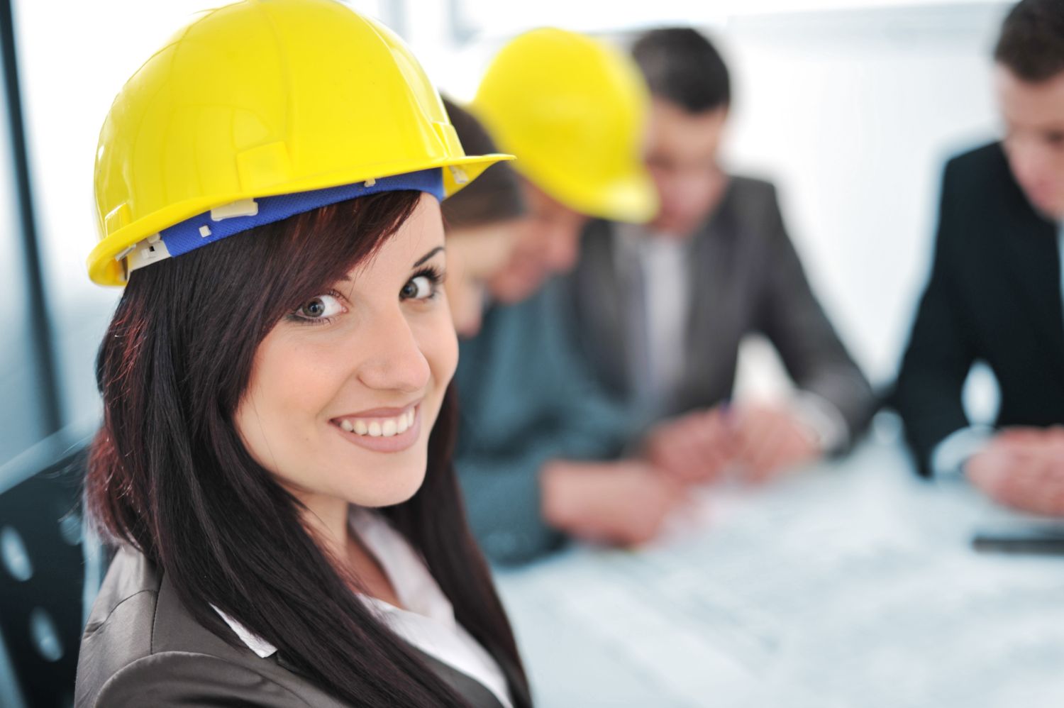 Engineering Candidate Woman in yellow hardhat smiling at camera